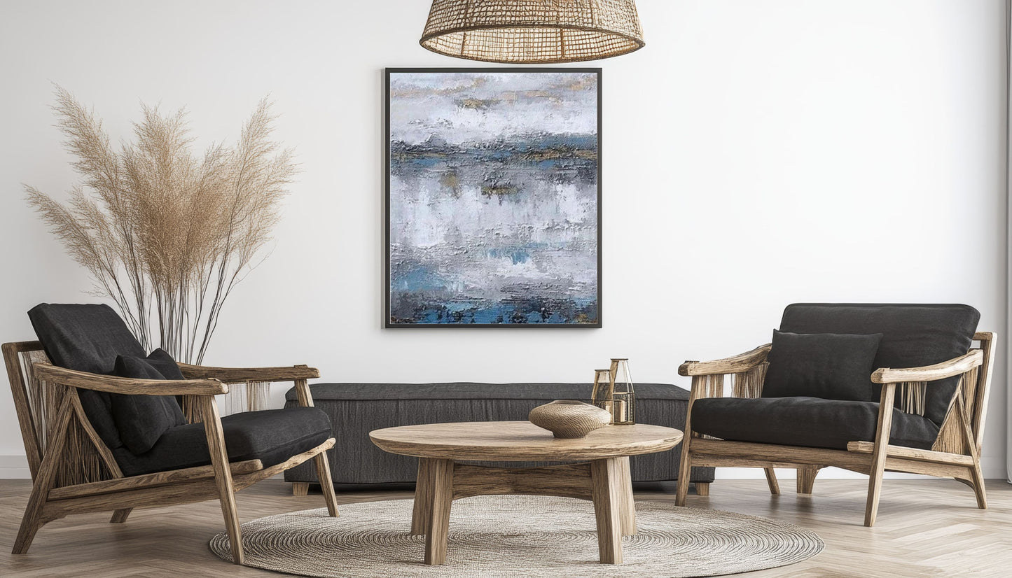 Modern living room with wooden chairs, round table, and abstract painting on the wall.