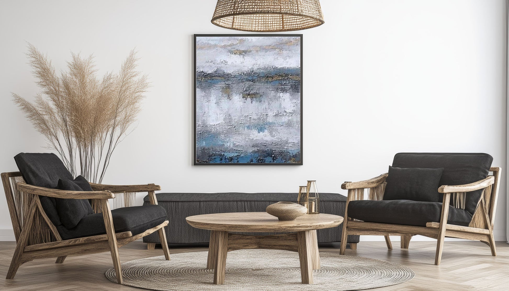 Modern living room with wooden chairs, round table, and abstract painting on the wall.