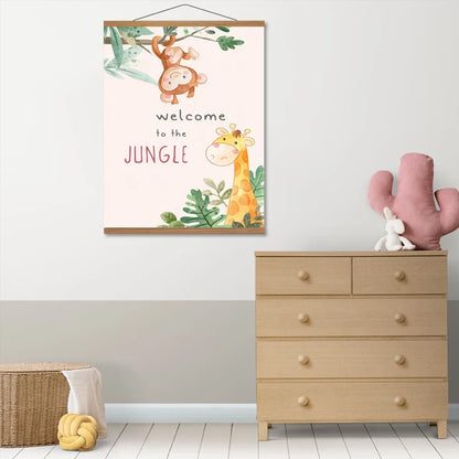 A children's nursery wall hanging poster with a jungle theme, featuring a monkey, giraffe, and the text 'welcome to the JUNGLE', displayed above a light wood dresser in a styled nursery room.