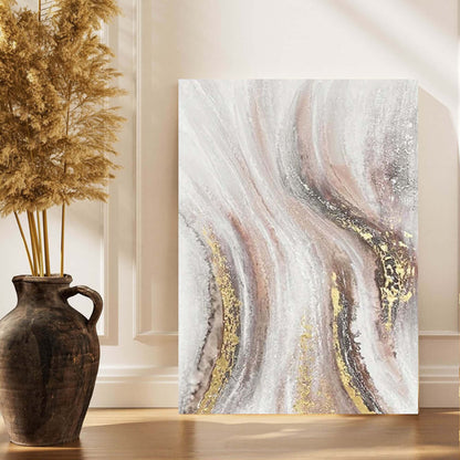 Abstract art piece on a wall with decorative elements in a room.