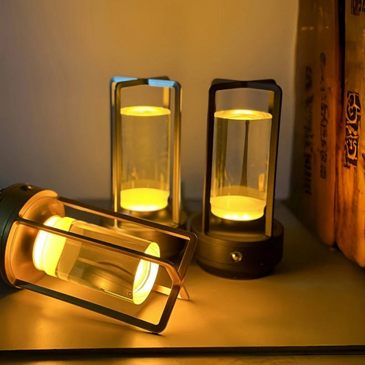 cylindrical lamps with glass covers on a surface, emitting a warm glow.