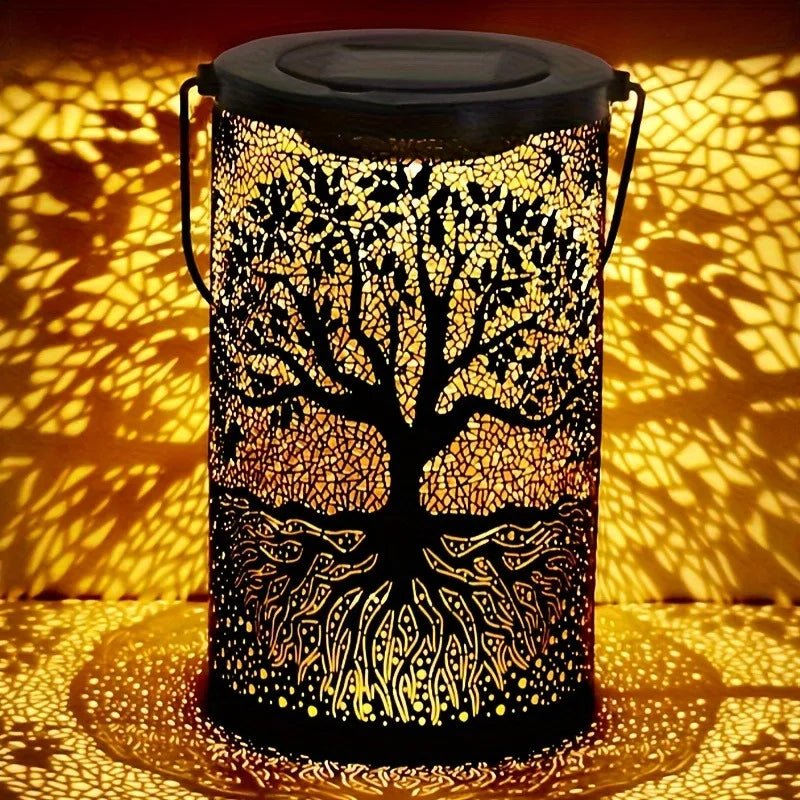 Decorative lantern with tree design casting shadows on a surface
