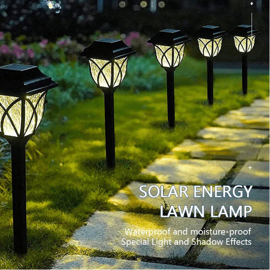 Solar energy lawn lamps on a grassy area with a stone pathway